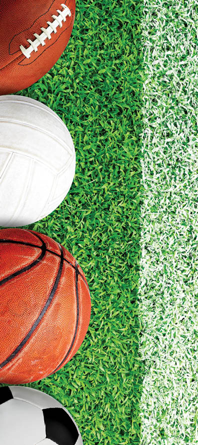 Top down view of popular sports equipment on field with painted white line marking for text copy space.