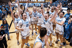 A group of cheerleaders celebrating a victory. Description generated by AI