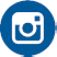 A white Instagram logo with a camera icon inside a blue circular background. Description generated by AI